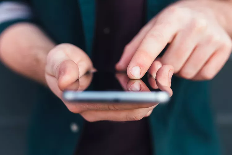 Man texting on a phone