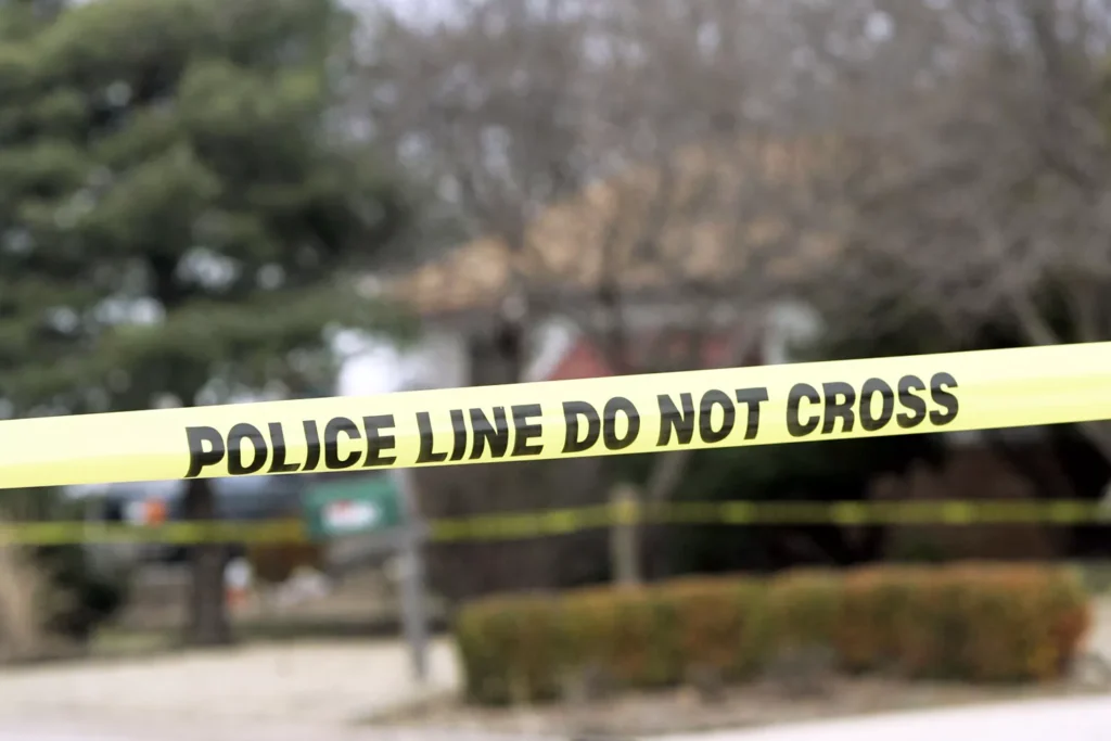 Generic image of police tape hanging across a street